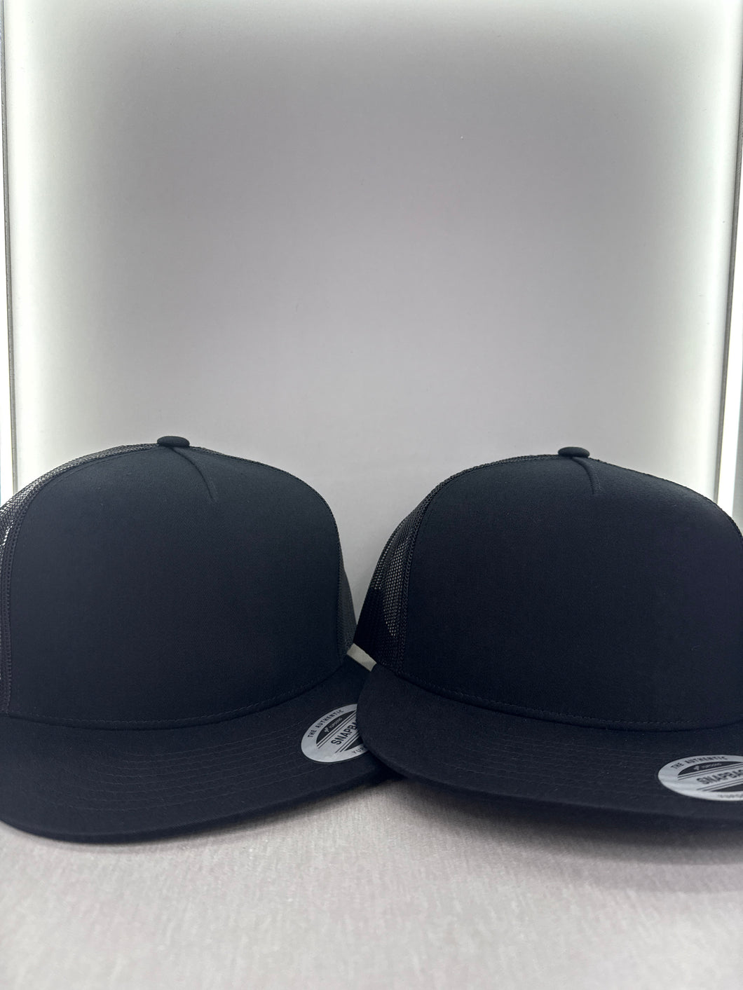 Yupoong Black blank trucker hats 2 for 25$